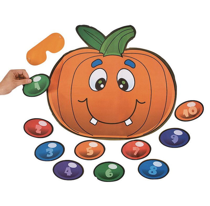 Pin the nose on the pumpkin game with smiling pumpkin, as an example of classroom decor for Halloween