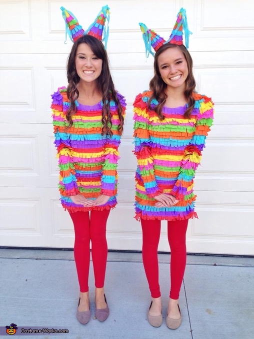 Two women are shown wearing brightly colored tops that look like pinatas.