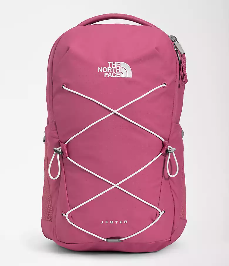 Pink North Face backpack with white lacing across the front