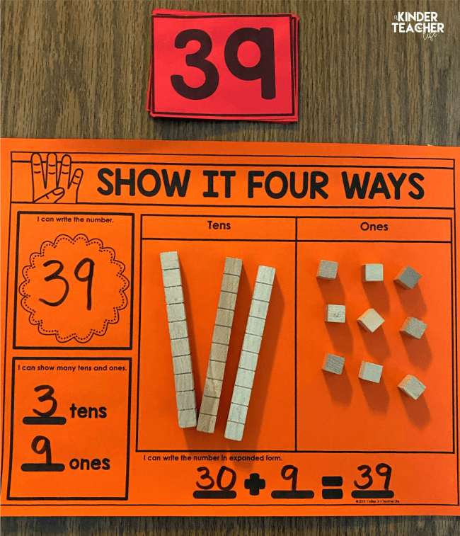 Orange worksheet with the number 39 represented as numerals, tens and ones, place value blocks, and 30+9