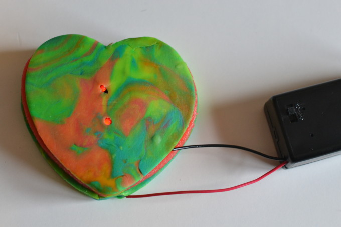 play dough heart with wires made into a circuit