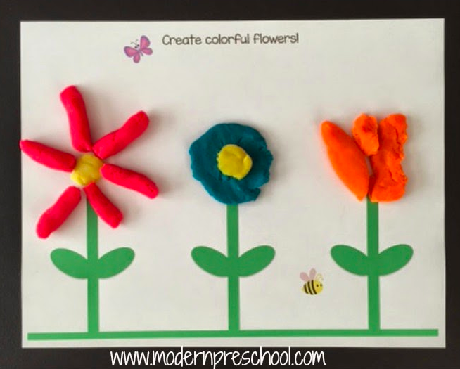 A pretty picture of colorful flowers made from play dough 