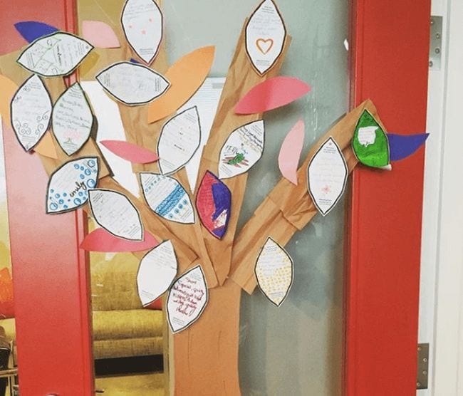 Paper tree hung with paper leaves with poems written on them