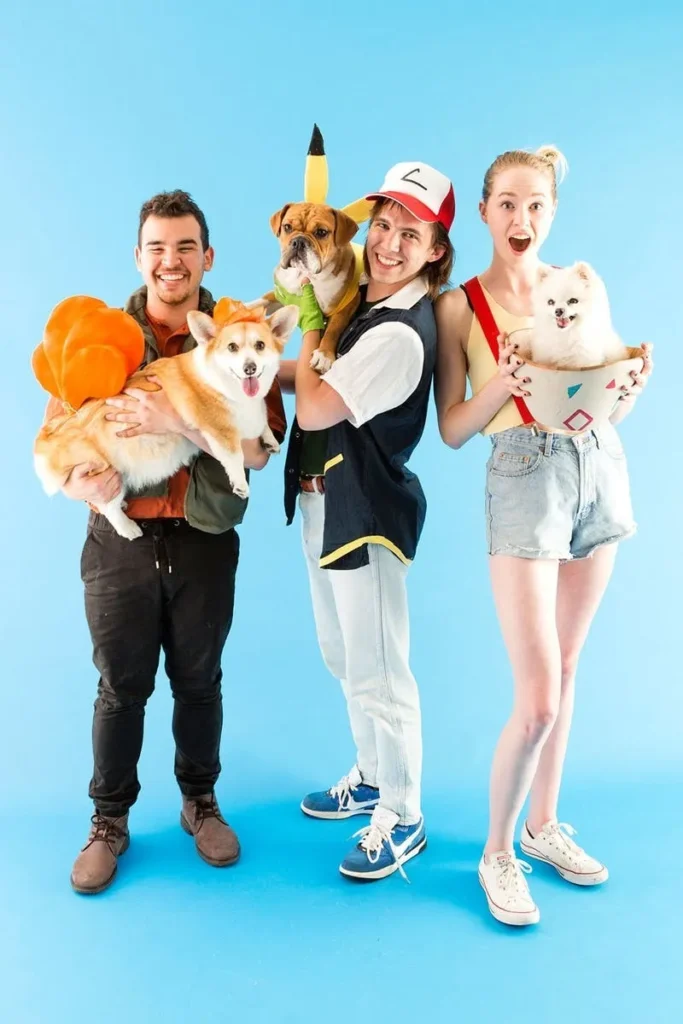 Three people and a dog are dressed as Pokemon characters