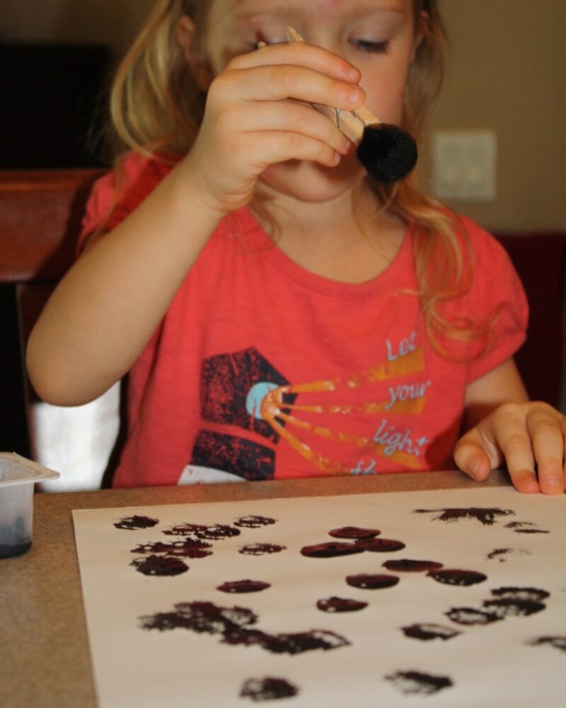 preschool activity: painting with pom poms on paper