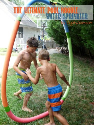 boy jumping through a sprinkler made of pool noodles for a water activity 