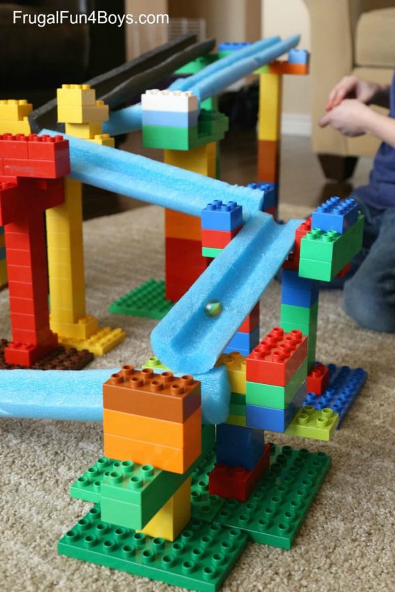 Marble run using pool noodles and other objects