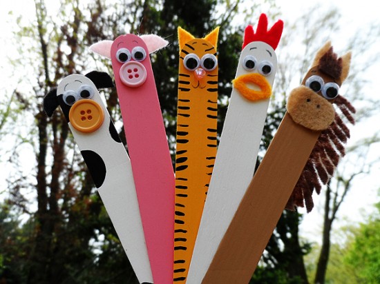 Whimsical puppets made from popsicle sticks in the form of a cow, pig, cat, chicken and horse