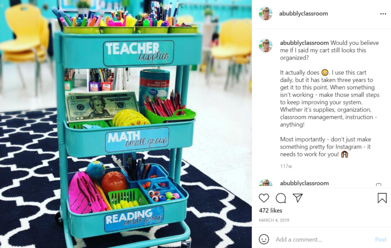 Teal, three level organization cart filled with school supplies in a classroom