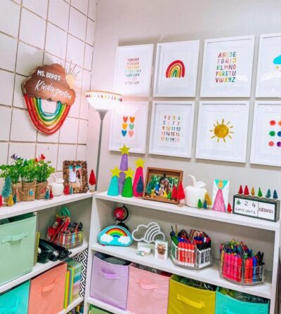 Kindergarten classroom corner with uplifting picture frames including a sun and a rainbow. 
