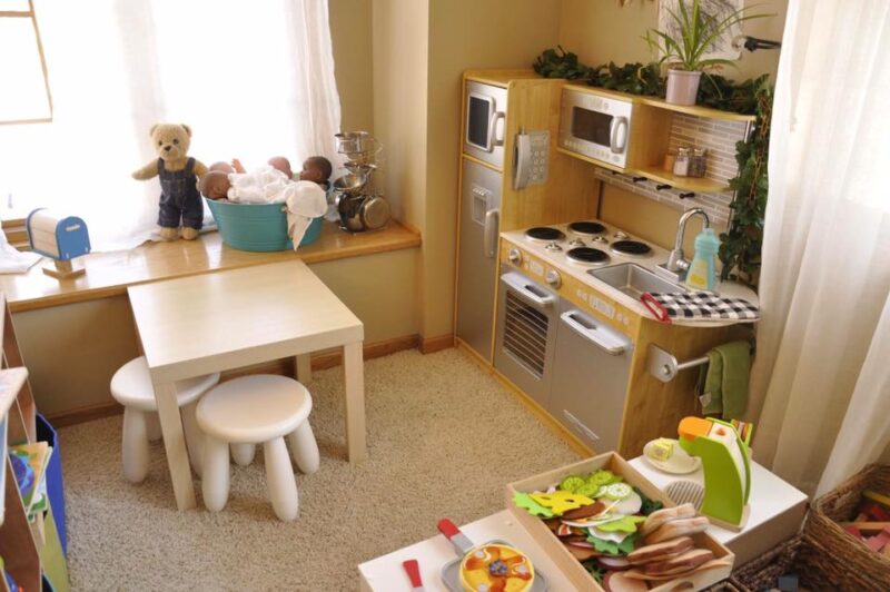 a dramatic play corner in a preschool