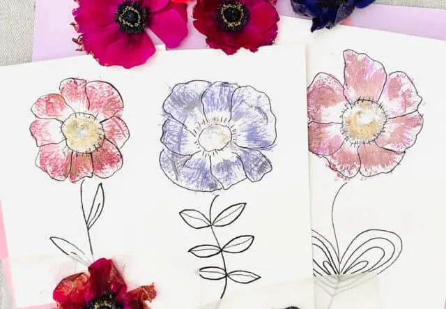 Three drawings of flowers made from pressed flowers and ink outlines as an example of summer crafts for kids