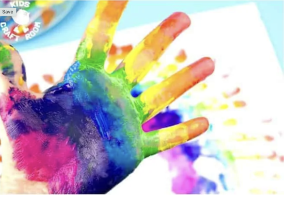 Hand covered in rainbow paint