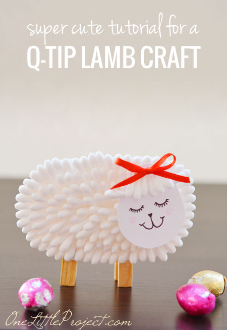 A little lamb is constructed from the heads of q-tips as wool (spring crafts for kids)