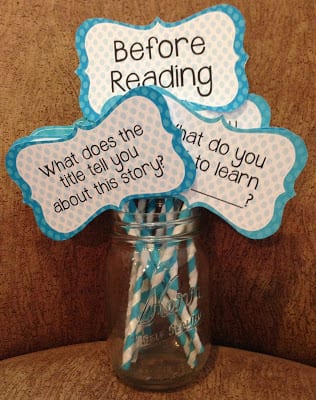 Jar with first grade reading comprehension question cards on colorful sticks