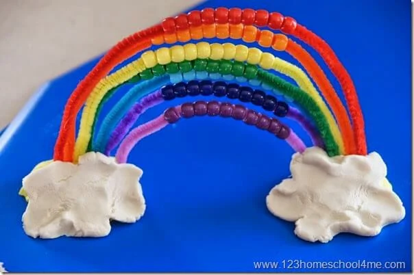 An abacus in the shape of a rainbow made from pipe cleaners and pony beads as an example of spring activities for preschoolers