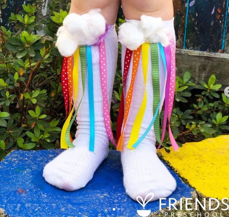 DIY rainbow socks made with ribbon and cotton balls
