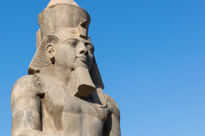 Statue of Ramesses II at Luxor temple with copy space, as an example of famous world leaders