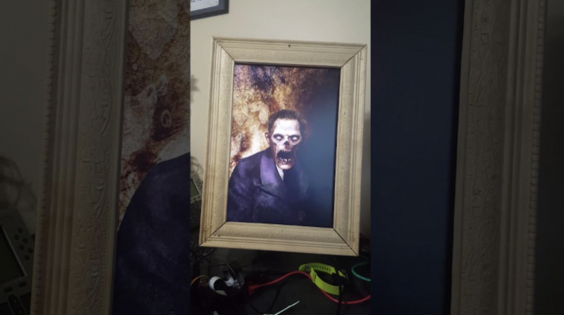 Haunted portrait hanging on wall