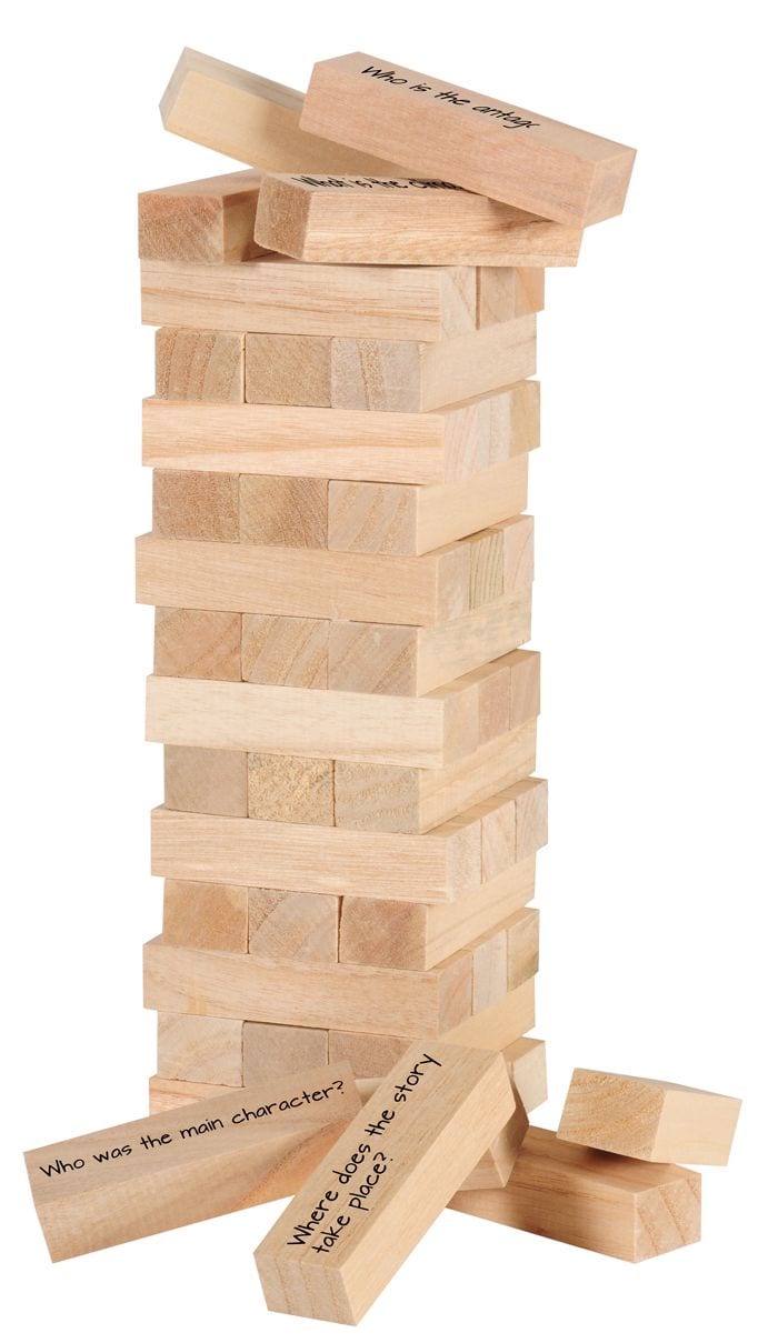 Jenga game with fourth grade reading comprehension questions written on blocks