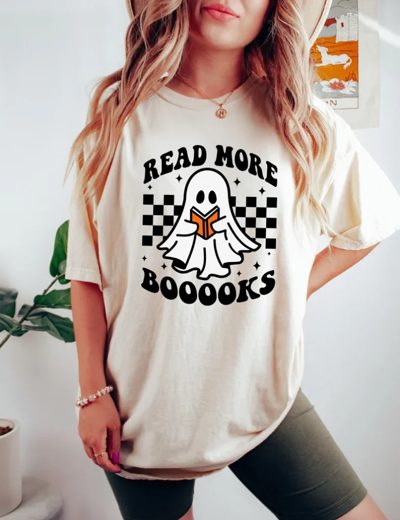 Halloween shirts include this t-shirt that has a ghost reading on it and says Read More Booooks.