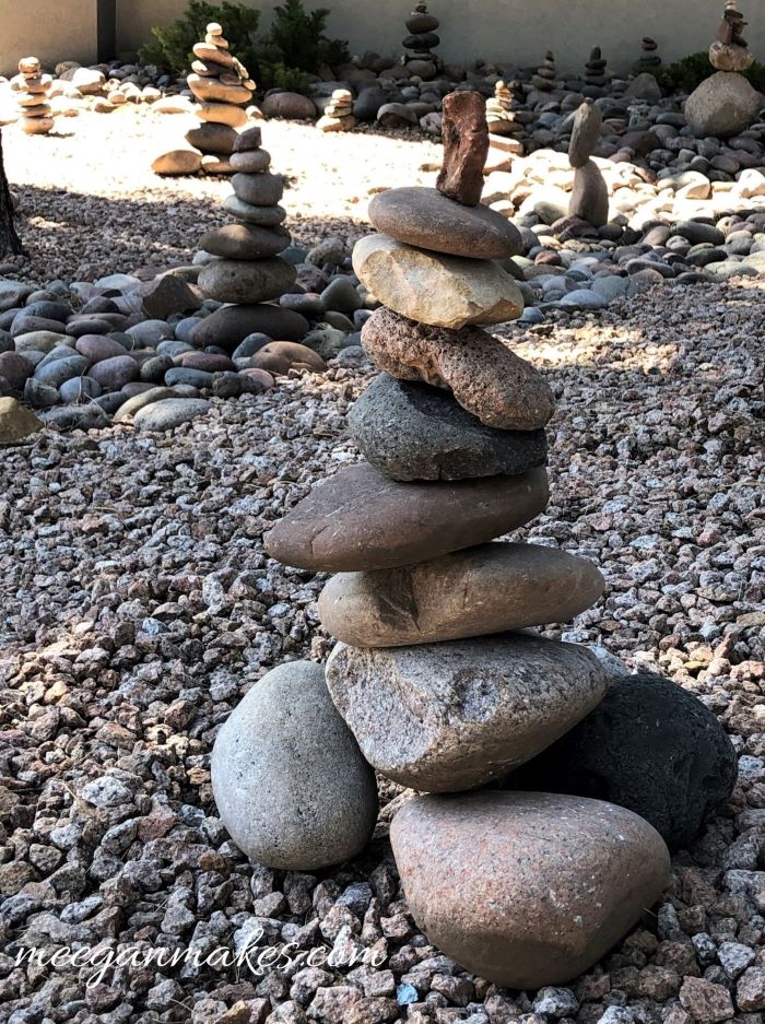 Stacks of rocks in towers outside.