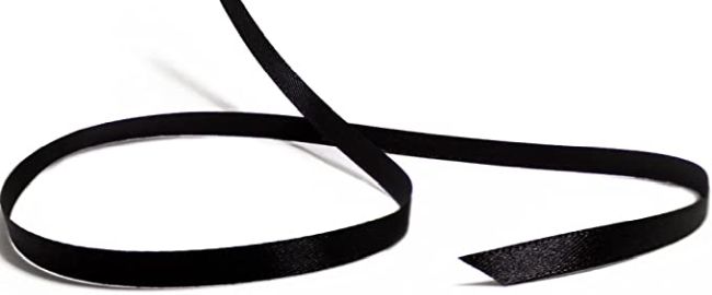 A piece of black ribbon against a white background