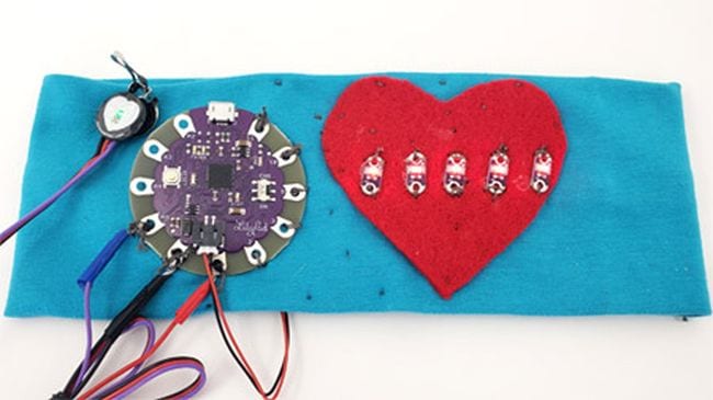 DIY heart rate monitor made from blue fabric and a red heart