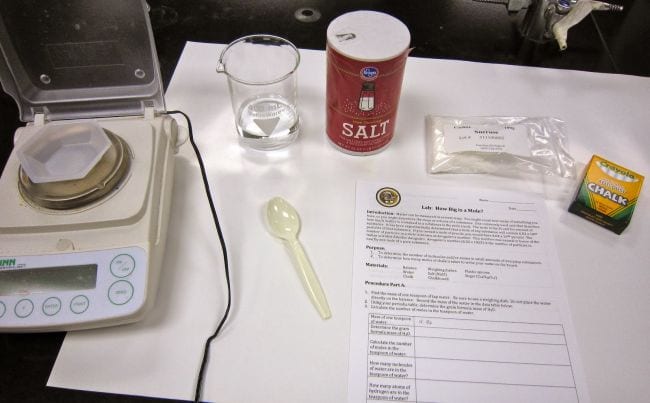 Supplies needed for mole experiment, included scale, salt, and chalk