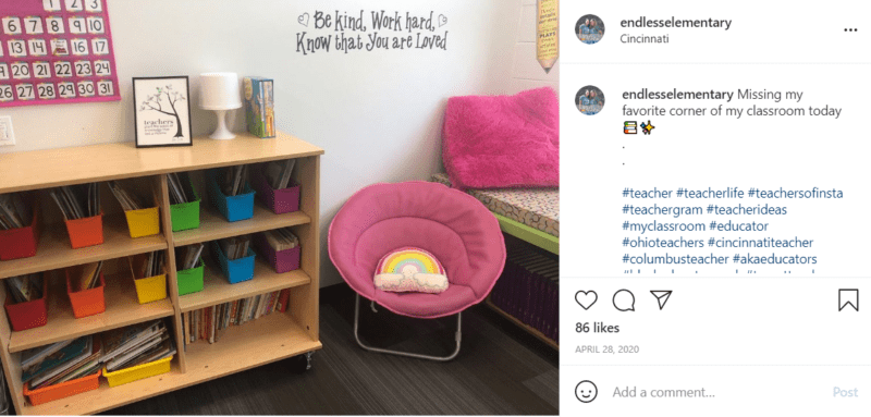 Classroom reading corner with shelving and a pink chair