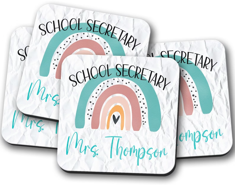 Personalized coasters featuring a colorful pastel rainbow and a heart as an example of gifts for paraprofessionals