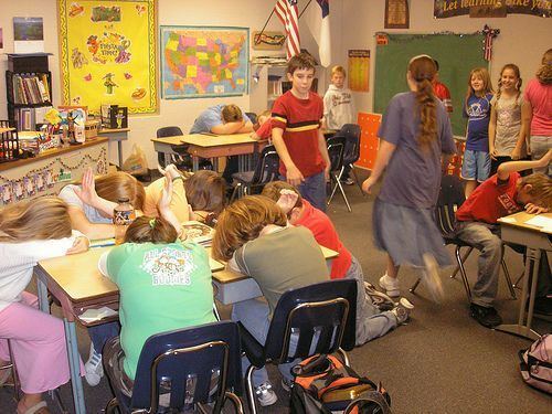 Kids in the classroom with their heads on their desks