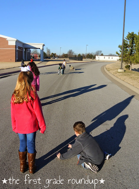 Students measuring each others' shadows for a solar eclipse activity 