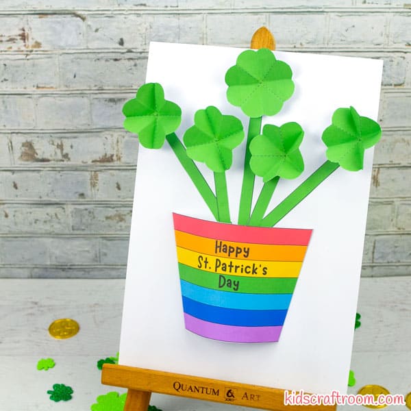 A 3-D plant is made from carstock. The pot is a rainbow and the shamrocks are the flowers.