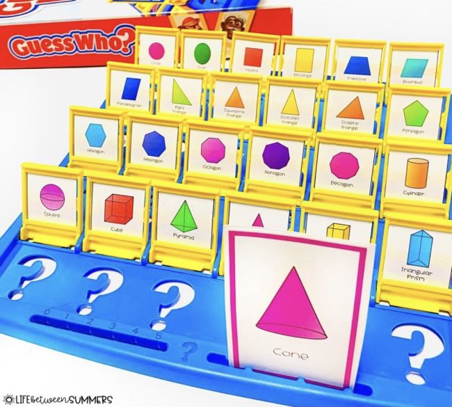 Guess Who game board with 2D and 3D shapes in place of the faces, used for first grade math games