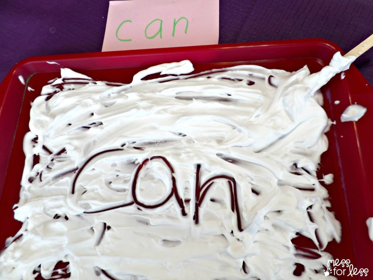 A tray of shaving cream with the word "can" written in the middle