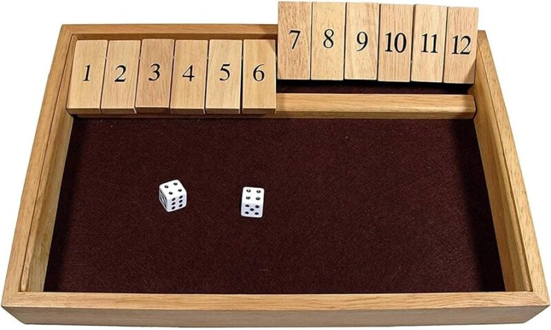 shut the box game with wooden numbers and dice 