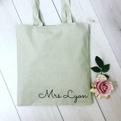 Green tote with teacher name at bottom