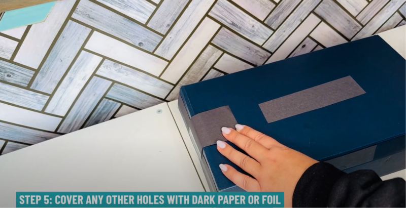 Solar Eclipse Viewer Step 5: Cover other holes the shoebox with dark paper or foil.