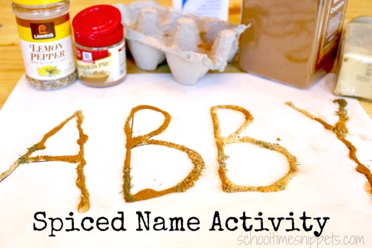 A child's name written by sprinkling spices on top of the script