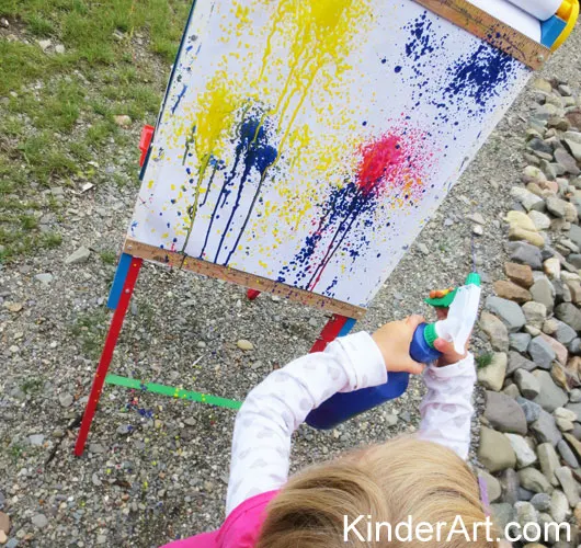 Girl spray painting- summer activities for kids
