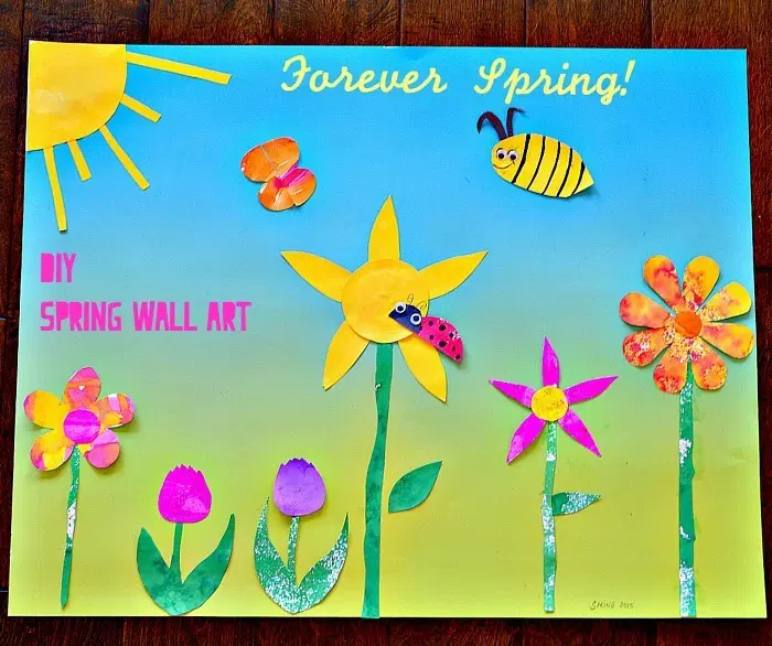 A bulletin board has a sun, flowers, bees, and butterflies on it.