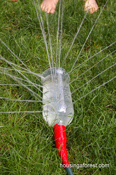 plastic bottle filled with water for a sprinkler 