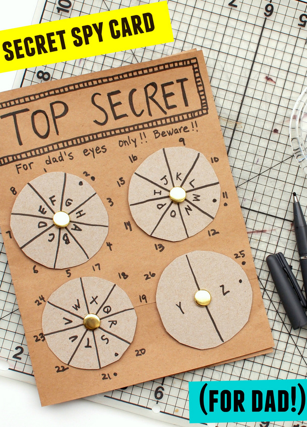 A cardboard cutout says Top Secret at the top and has four separate spinners with codes on them, Father's Day crafts for kids.