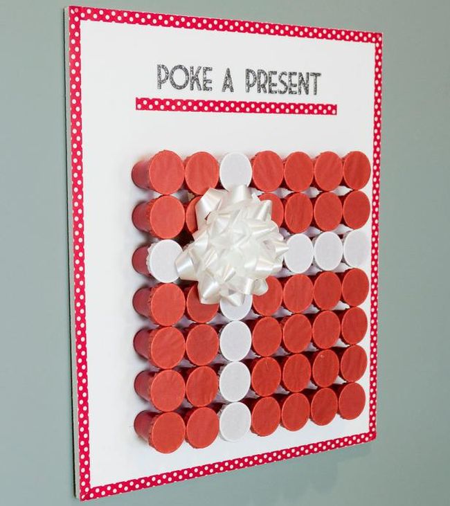 Poke A Present board with cups glued on sideways and covered with tissue paper