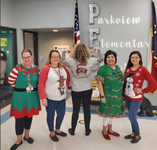 Teachers participating in an Ugly Sweater Contest