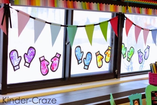 "Stained glass" mittens made from tissue paper mosaic adorn a classroom window