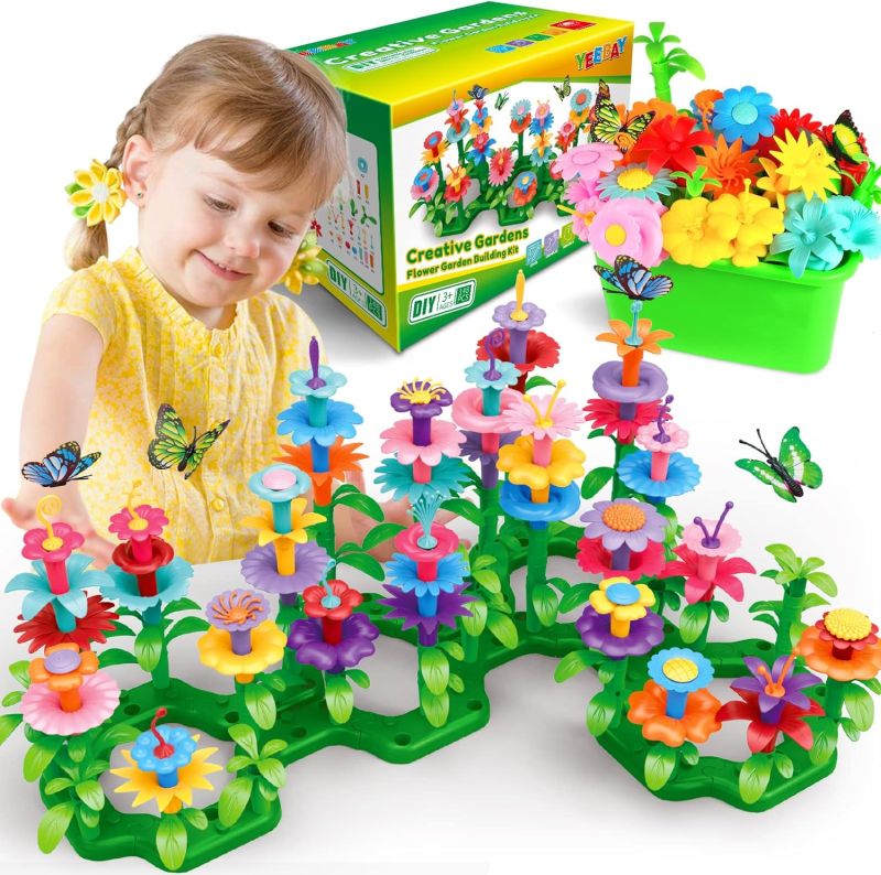 Child playing with a flower garden building blocks set