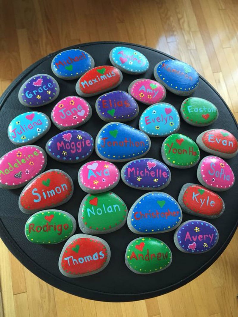 Names painted colorfully on smooth rocks for gift or project