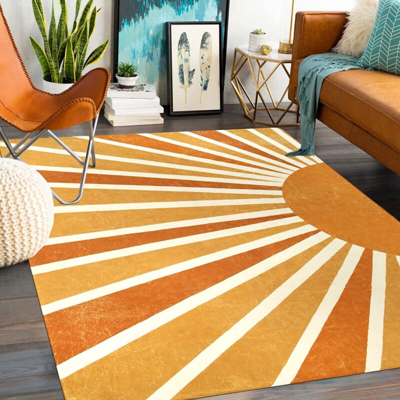 A rug shows the rays of the sun in different bright shades of orange.